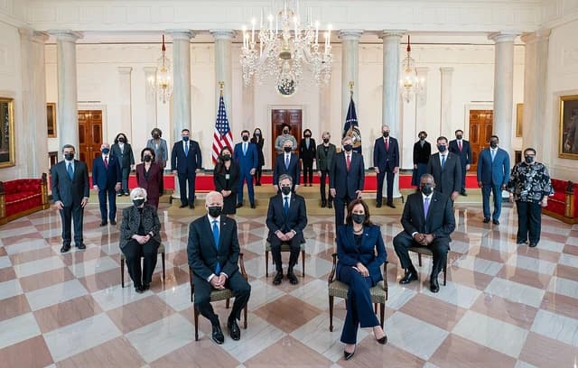 President Joe Biden and Vice President Kamala Harris with cabinet members in the White House.