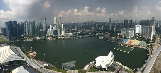 Panoramic view of Singapore's Marina Bay waterfront with city skyscrapers.