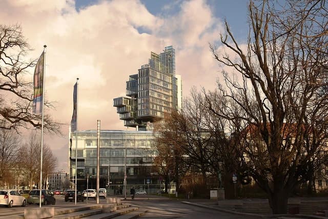 Nord/LB headquarters building in Hannover, Germany, under a cloudy sky.