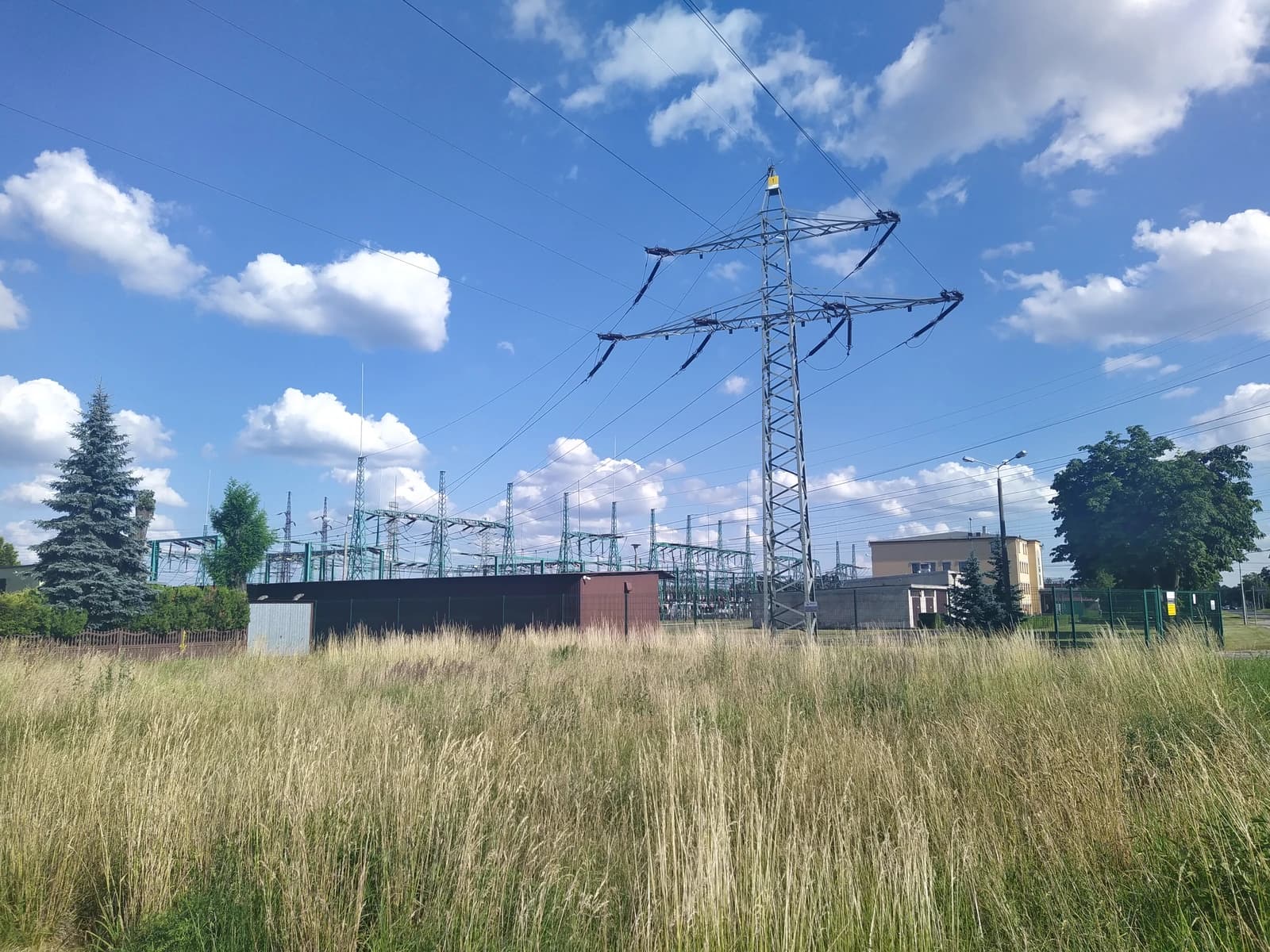 Groszowice substation in Poland with a large transmission tower and power lines.