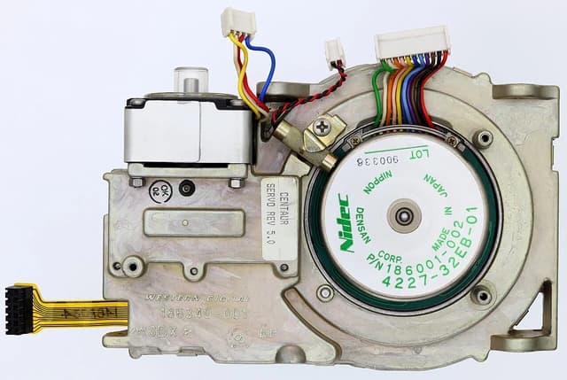 Close-up of a Western Digital hard drive motor component with multicolored wires.