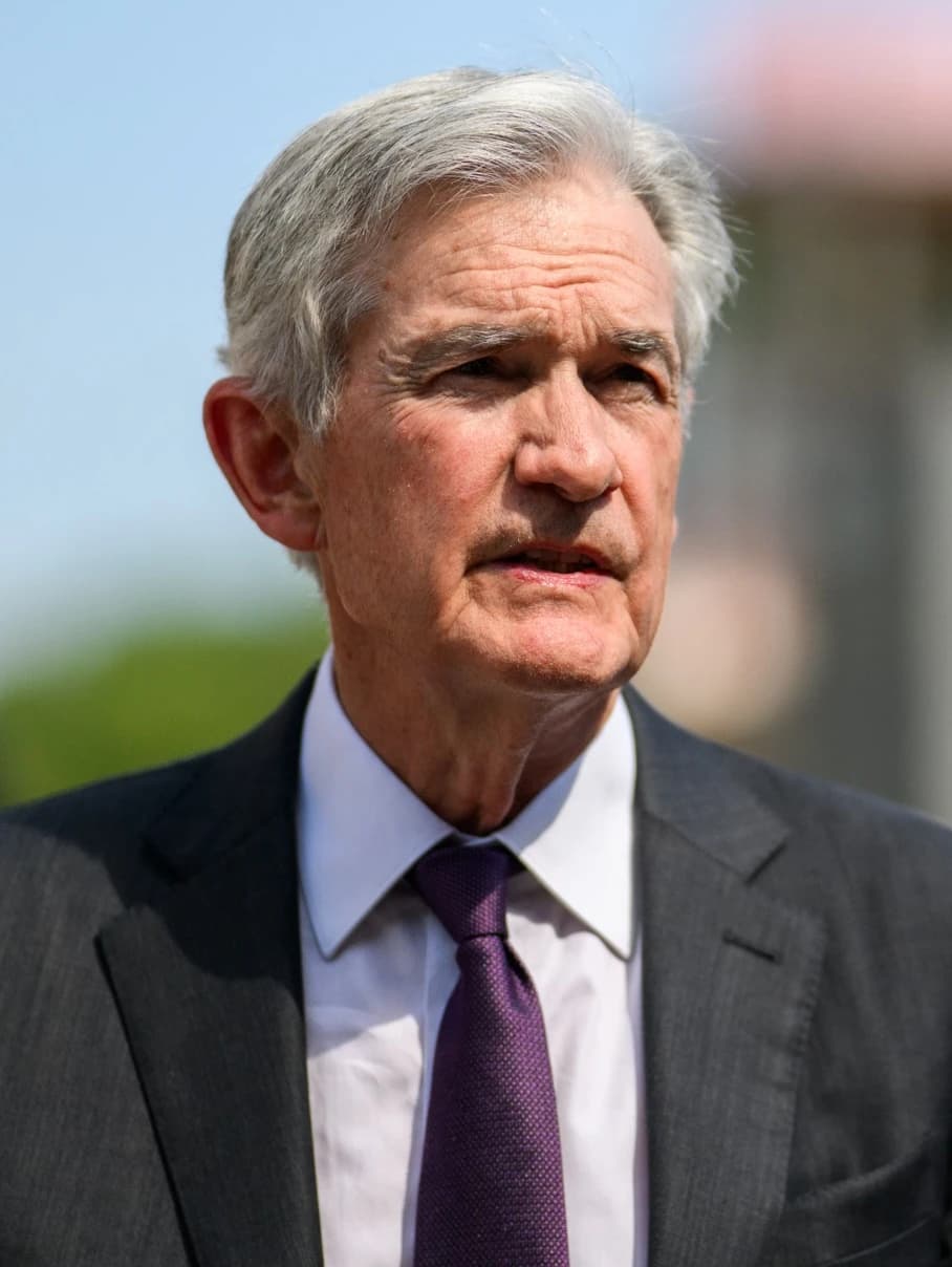 Jerome Powell, Chairman of the Federal Reserve, standing outdoors.