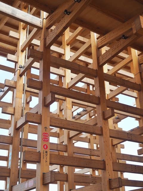 Close-up view of the intricate wooden beam and column structure of the Grand Ring.