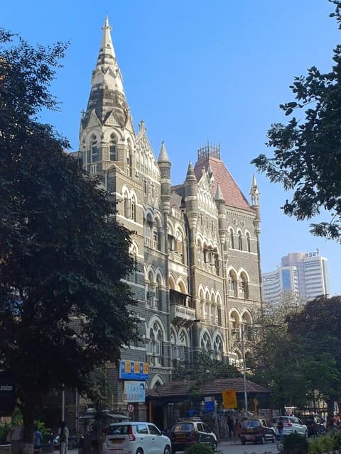 Oriental Building and the distinctive Bombay Stock Exchange building with 'BSE' signage in Mumbai.