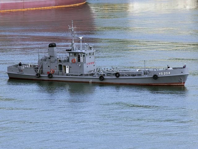Japanese Maritime Self-Defense Force Yard Jet Fuel Tanker YG-204 floating on blue water.