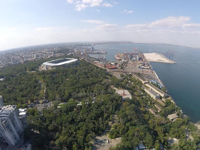 Aerial view of Odessa Seaport showing docks, cranes, and ships.