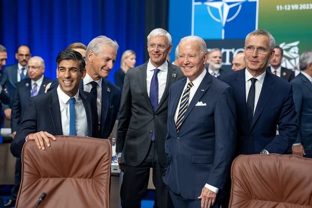 President Joe Biden smiles alongside G7 leaders at the NATO Summit in Vilnius.