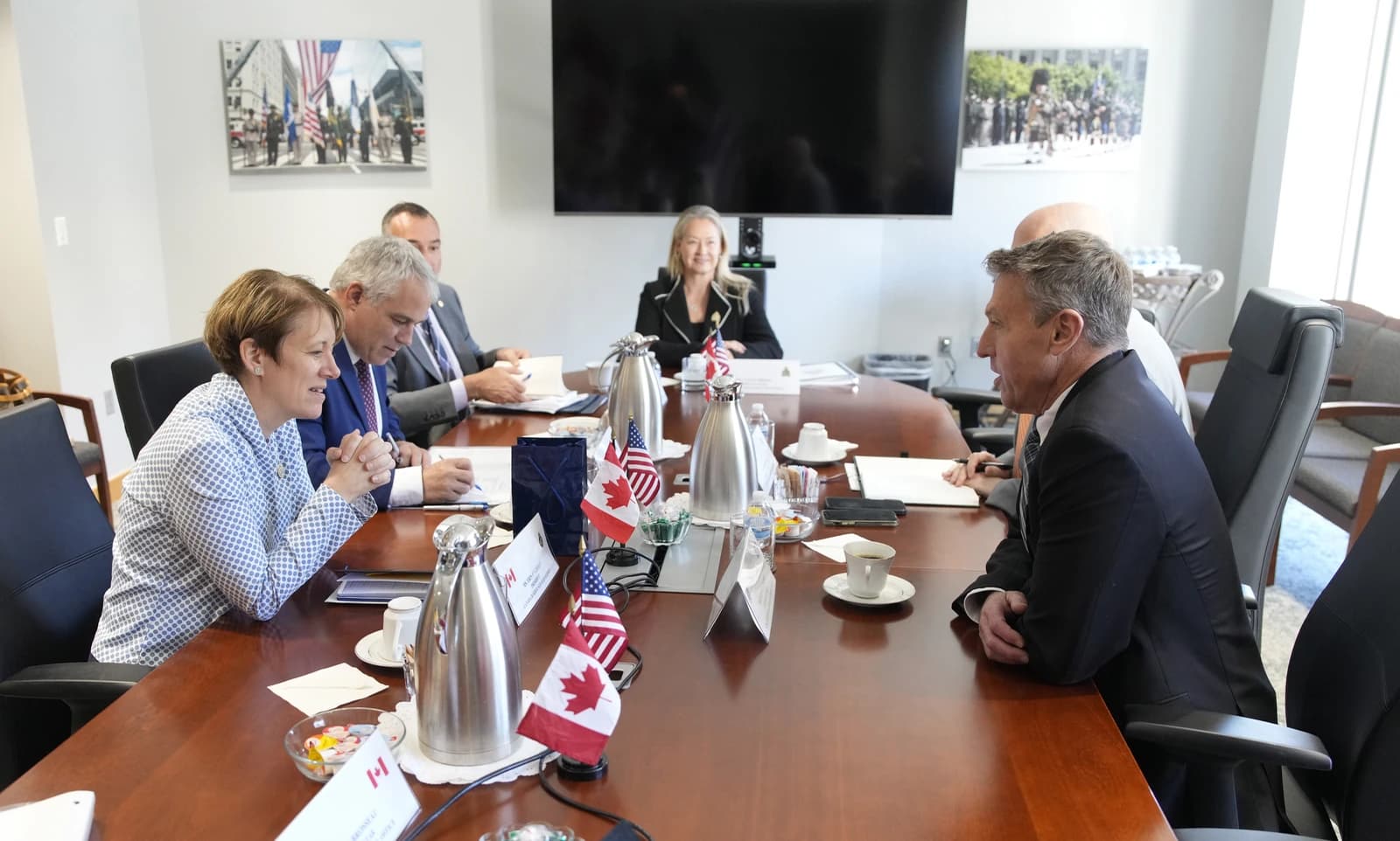 CBP Commissioner Rodney S. Scott and Canadian officials seated around a conference table.