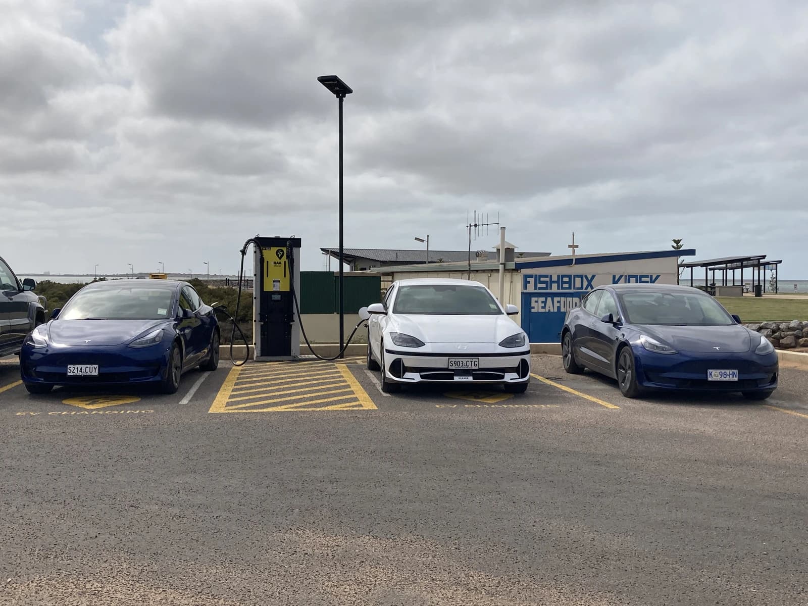 Electric cars parked at RAA EV charging station, Cowell, South Australia.