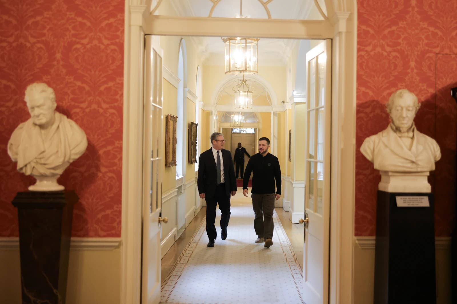 Prime Minister Keir Starmer and President Volodymyr Zelenskyy walk through a hallway at 10 Downing Street.