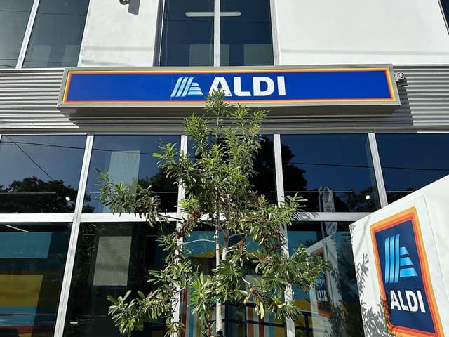 Exterior view of an Aldi store in Miami, Florida, with the brand sign visible.