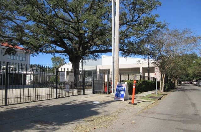 Vote Here sign outside Lusher School polling place, New Orleans, 2020 Election Day.