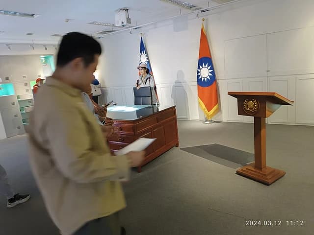 Exhibition in Taipei, Taiwan showing a podium with the emblem of the Office of the President.