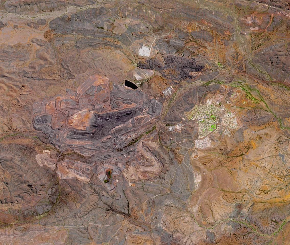 Aerial view of Mount Whaleback iron ore mine, a massive open-pit operation.