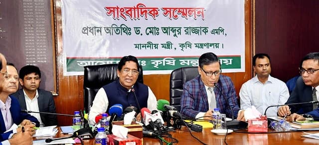 Abdur Razzaque, Bangladesh Agriculture Minister, speaking at a press conference in a ministry conference room.