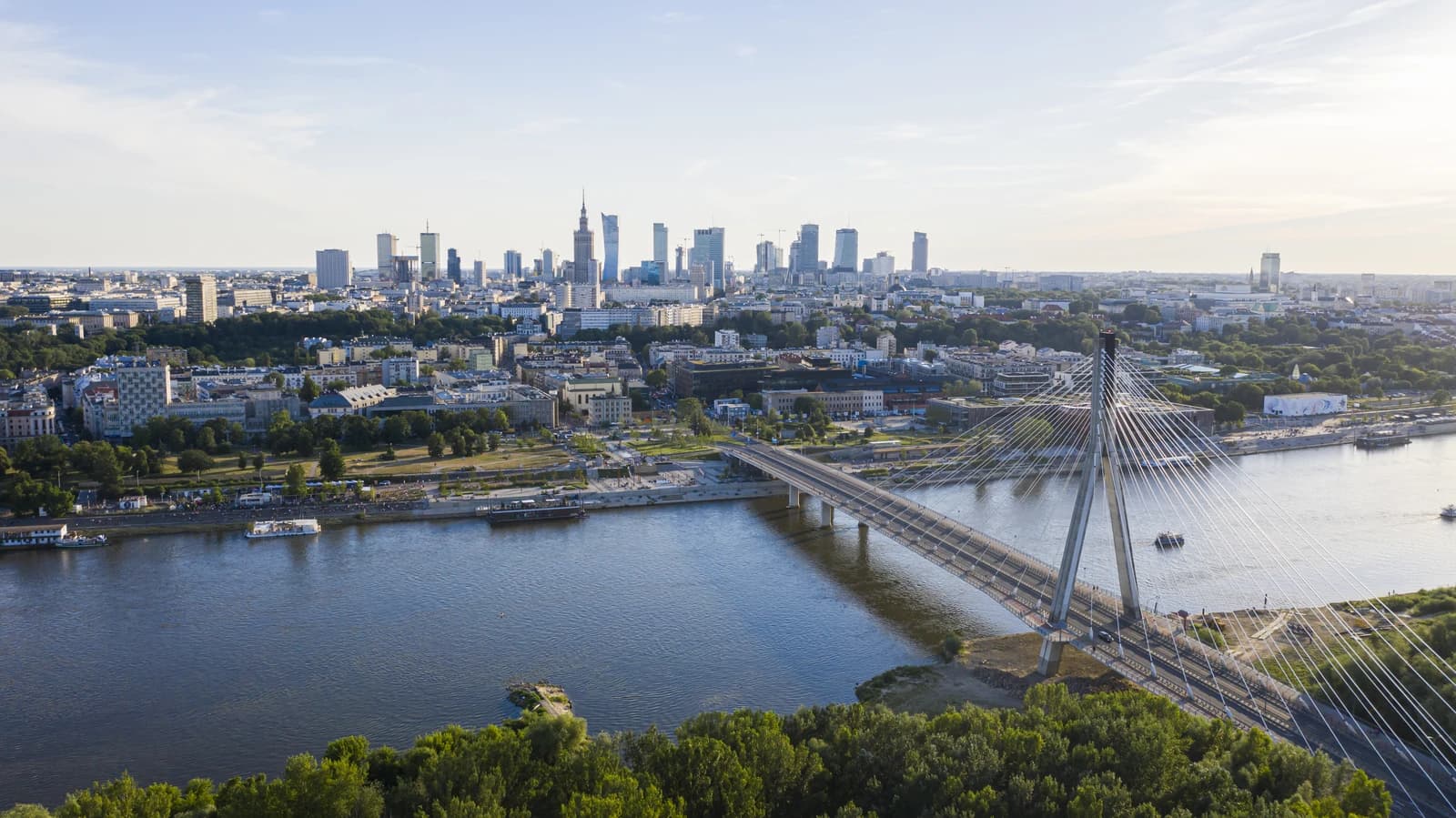 Warsaw skyline with the Świętokrzyski Bridge spanning the Vistula River.