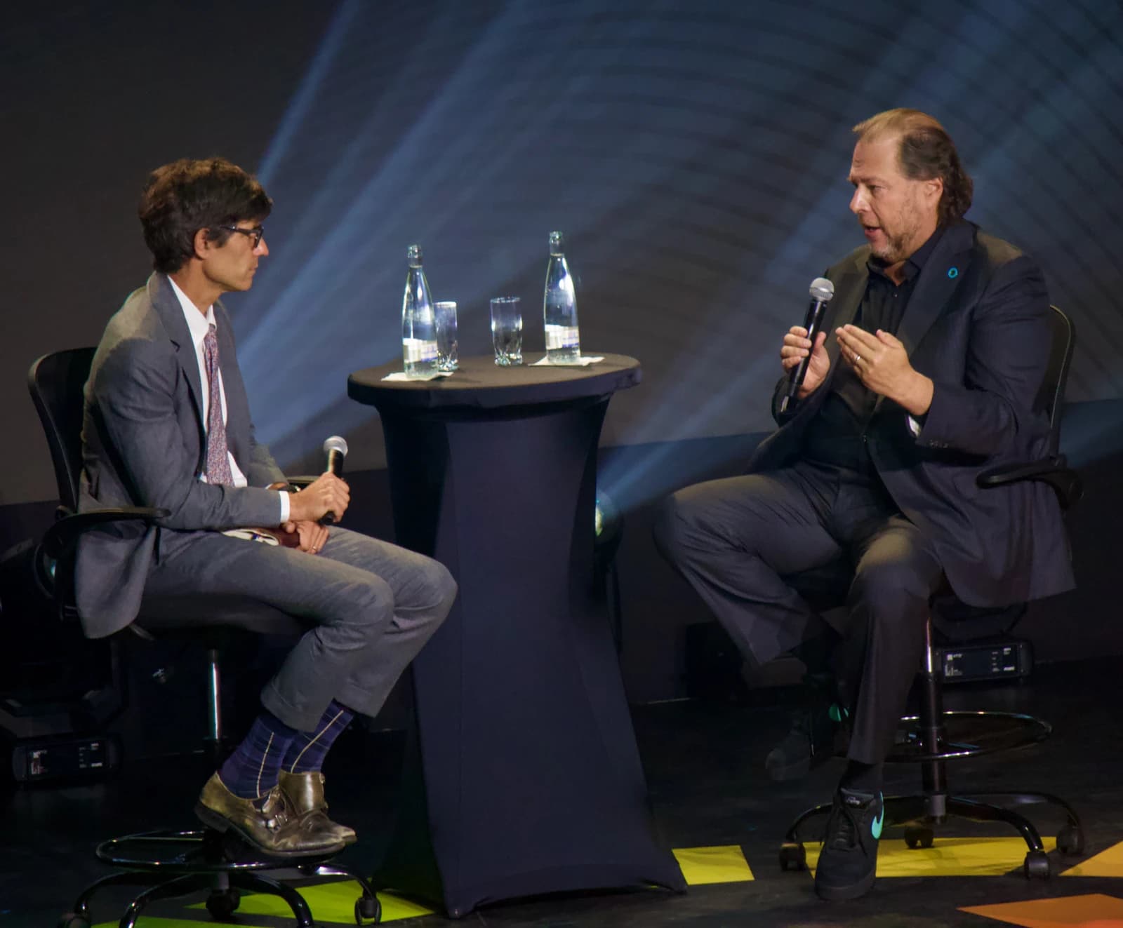 Marc Benioff, CEO of Salesforce, speaking into a microphone at an event.