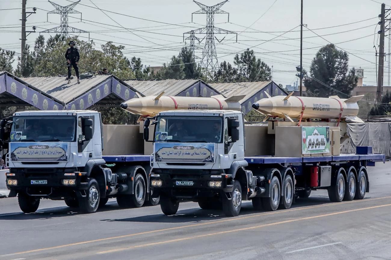 Iranian Kheibar Shekan ballistic missiles displayed on transport trucks during a military parade.