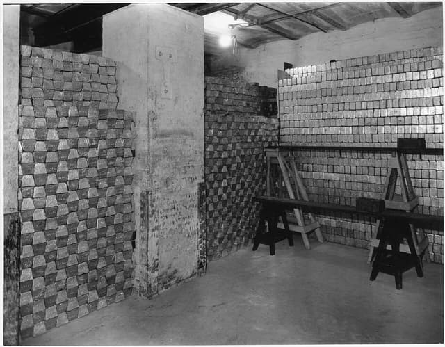 Stacks of gold bars stored inside a vault at a depository.