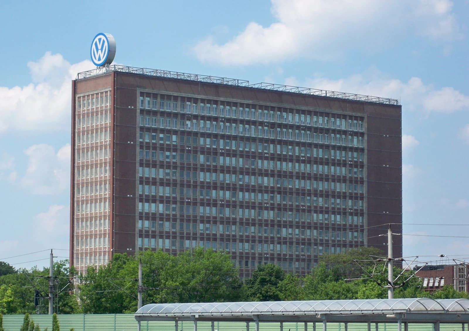 Volkswagen high-rise building with the iconic circular VW logo on its roof in Wolfsburg.