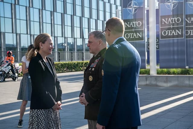 General Mark Milley, Chairman of the Joint Chiefs of Staff, is greeted by officials at NATO Headquarters.