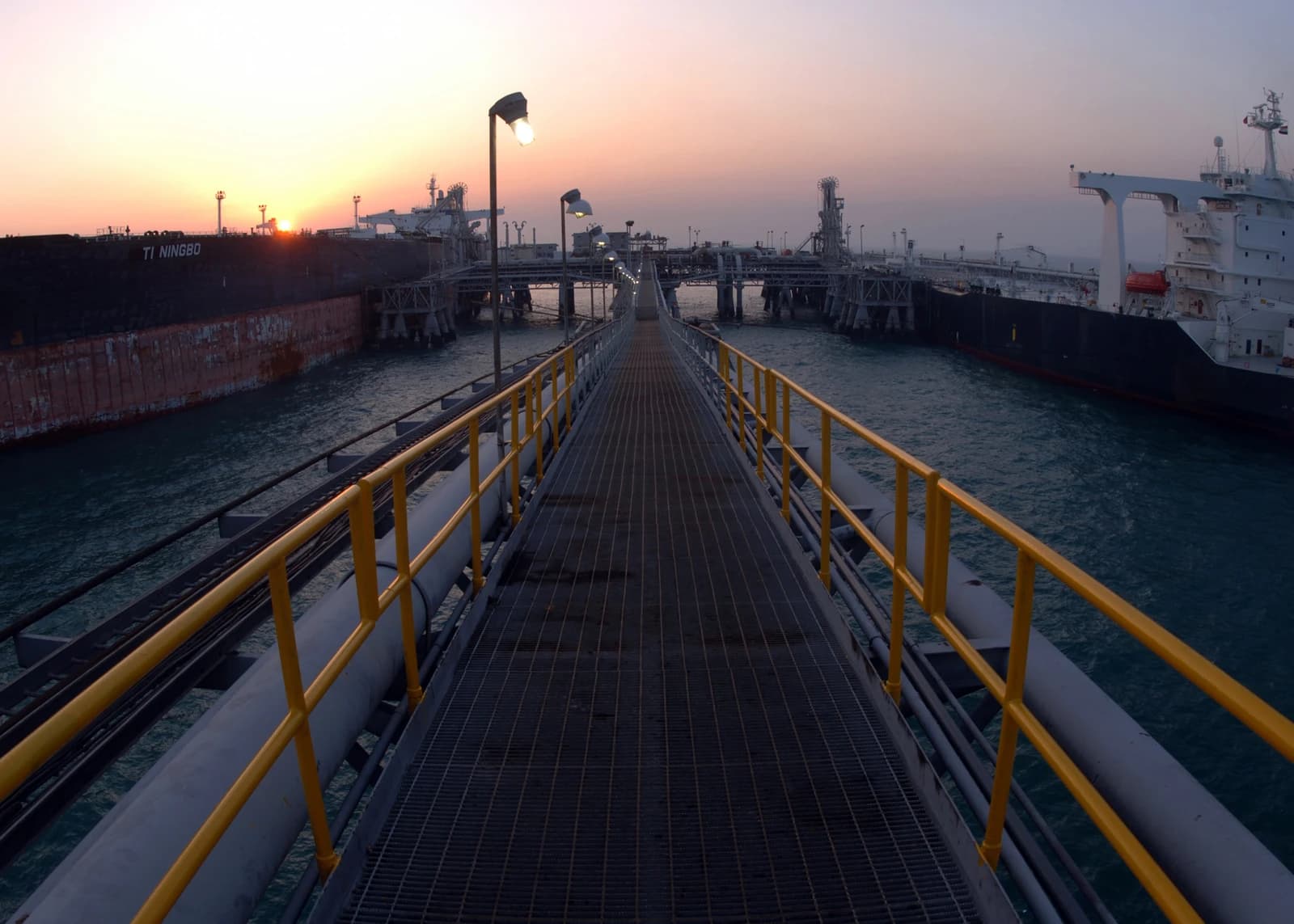 Sunrise view of the Al Basra Oil Terminal with ships docked at the facility.