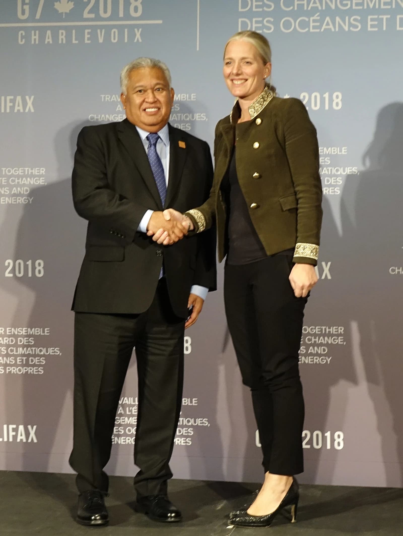 Gerald Zackios, Marshall Islands Ambassador, and Catherine McKenna, Canadian Minister, shaking hands.
