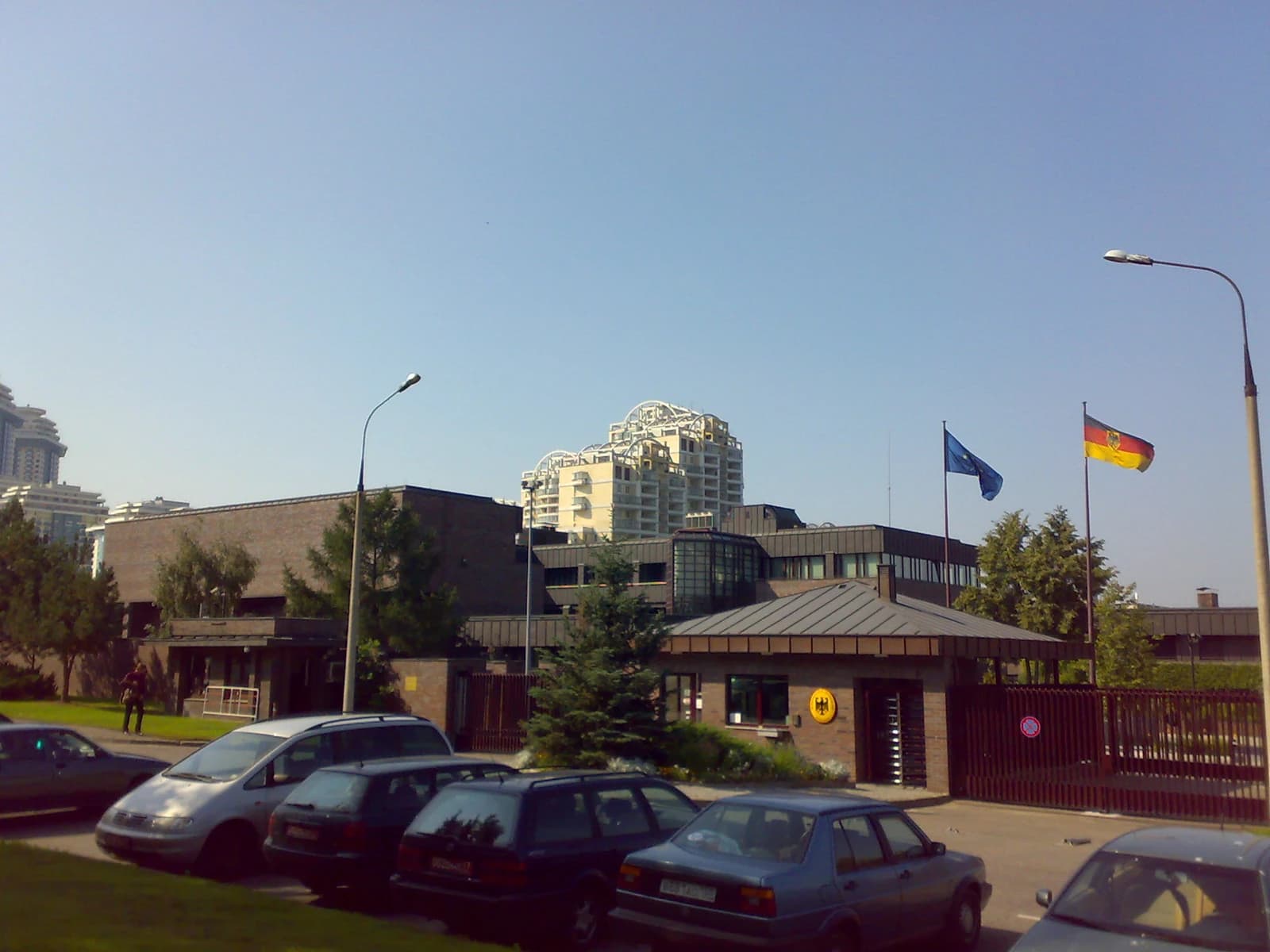 Exterior view of the German Embassy building with German and European Union flags flying.