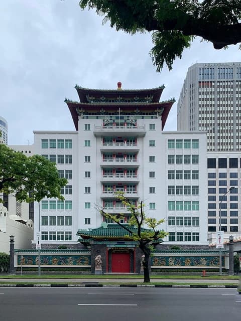 Exterior of the Singapore Chinese Chamber of Commerce and Industry building, a multi-story white building with a traditional Chinese roof.