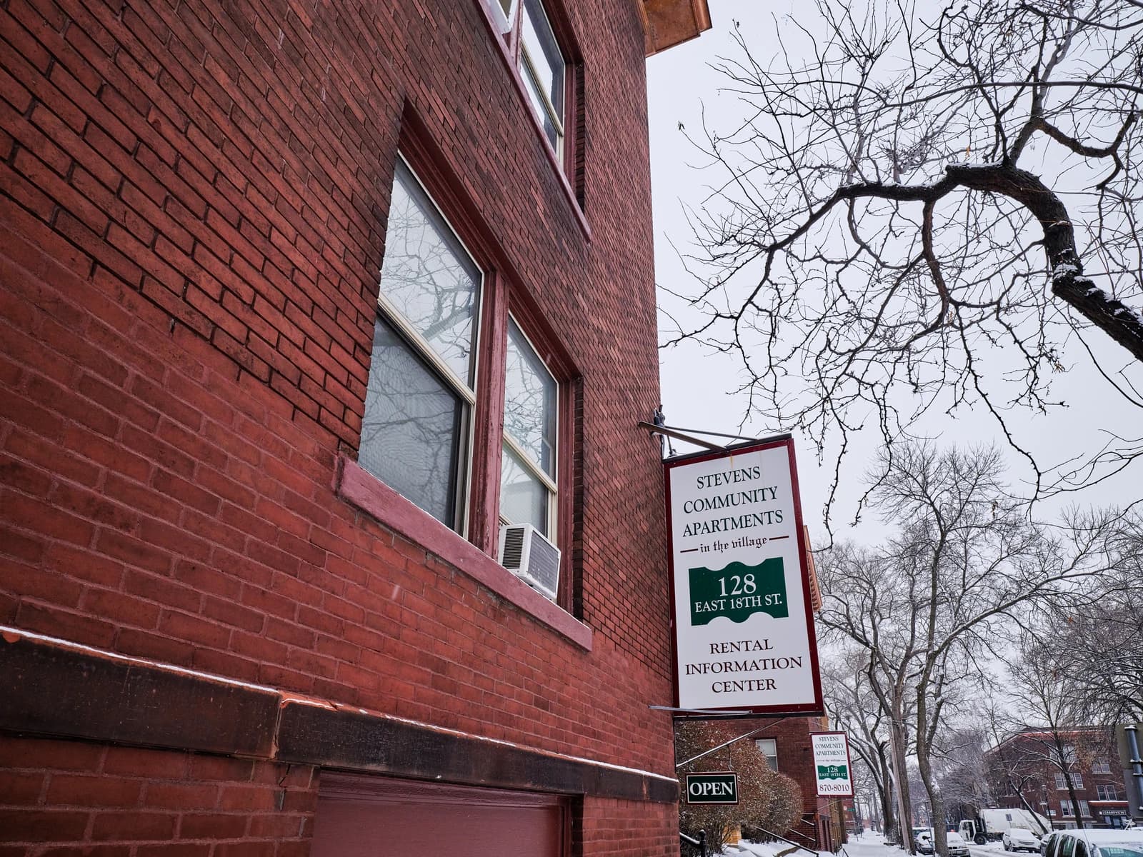 Stevens Community Apartments Rental Office sign on a brick building in Minneapolis.