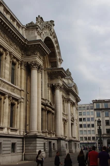 Exterior facade of the Bourse de Bruxelles building with ornate architecture and columns.
