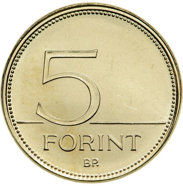 Hungarian five Forint coin with the number 5 and the word 'FORINT' visible.