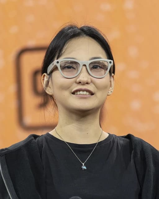Youna Kang wearing white Ray-Ban Meta smart glasses.