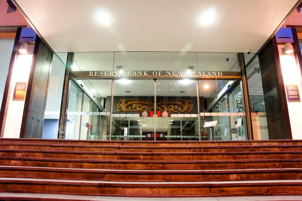 Entrance of the Reserve Bank of New Zealand building, with steps leading up to glass doors.