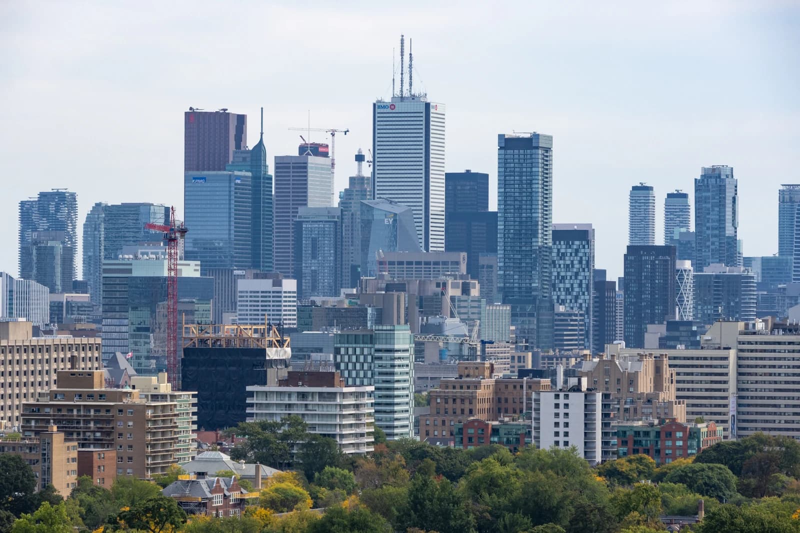 Toronto city skyline with office buildings and residential towers visible from a distance.