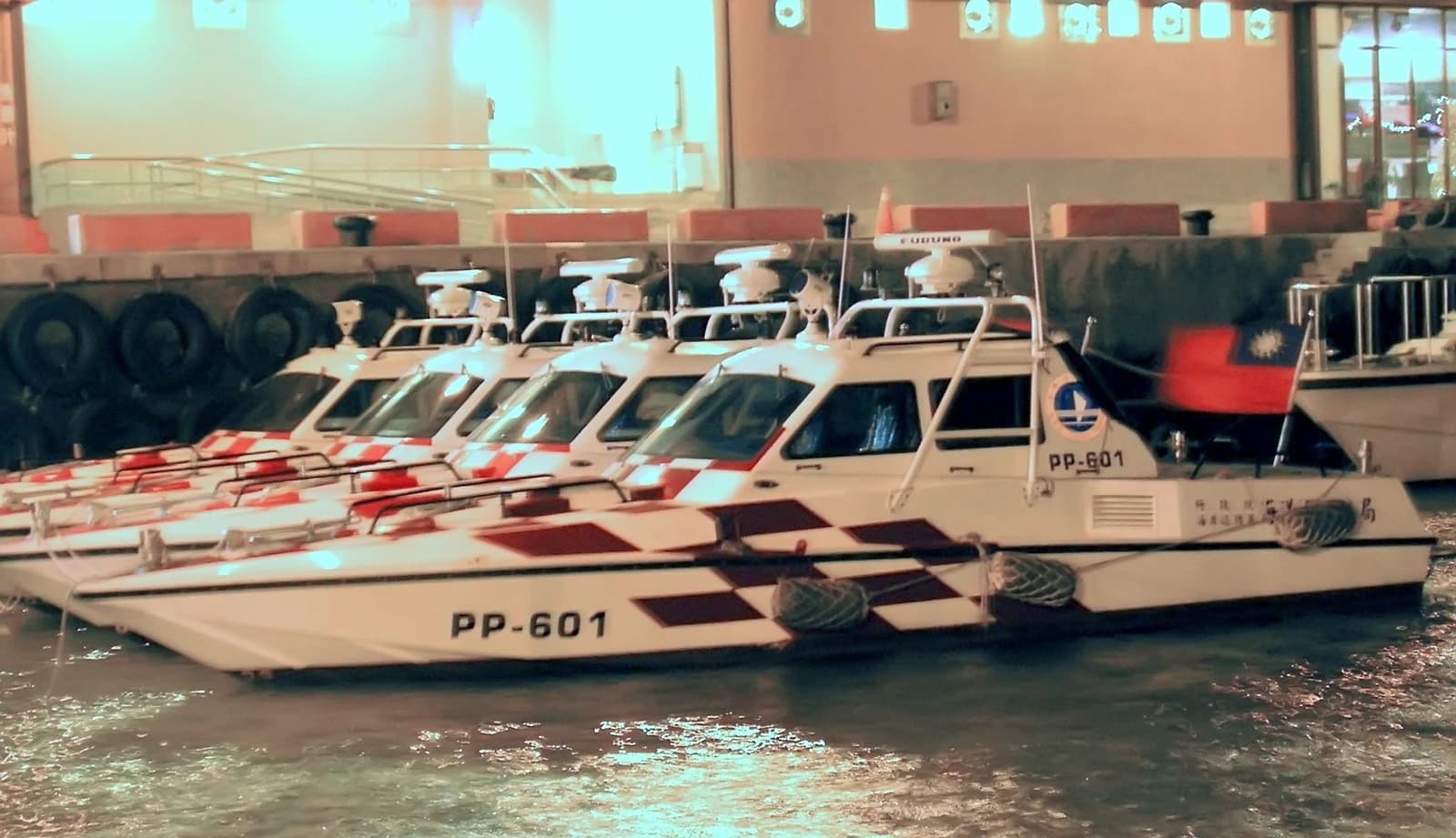 Taiwan Coast Guard speedboats, including PP-601, docked in a harbor.