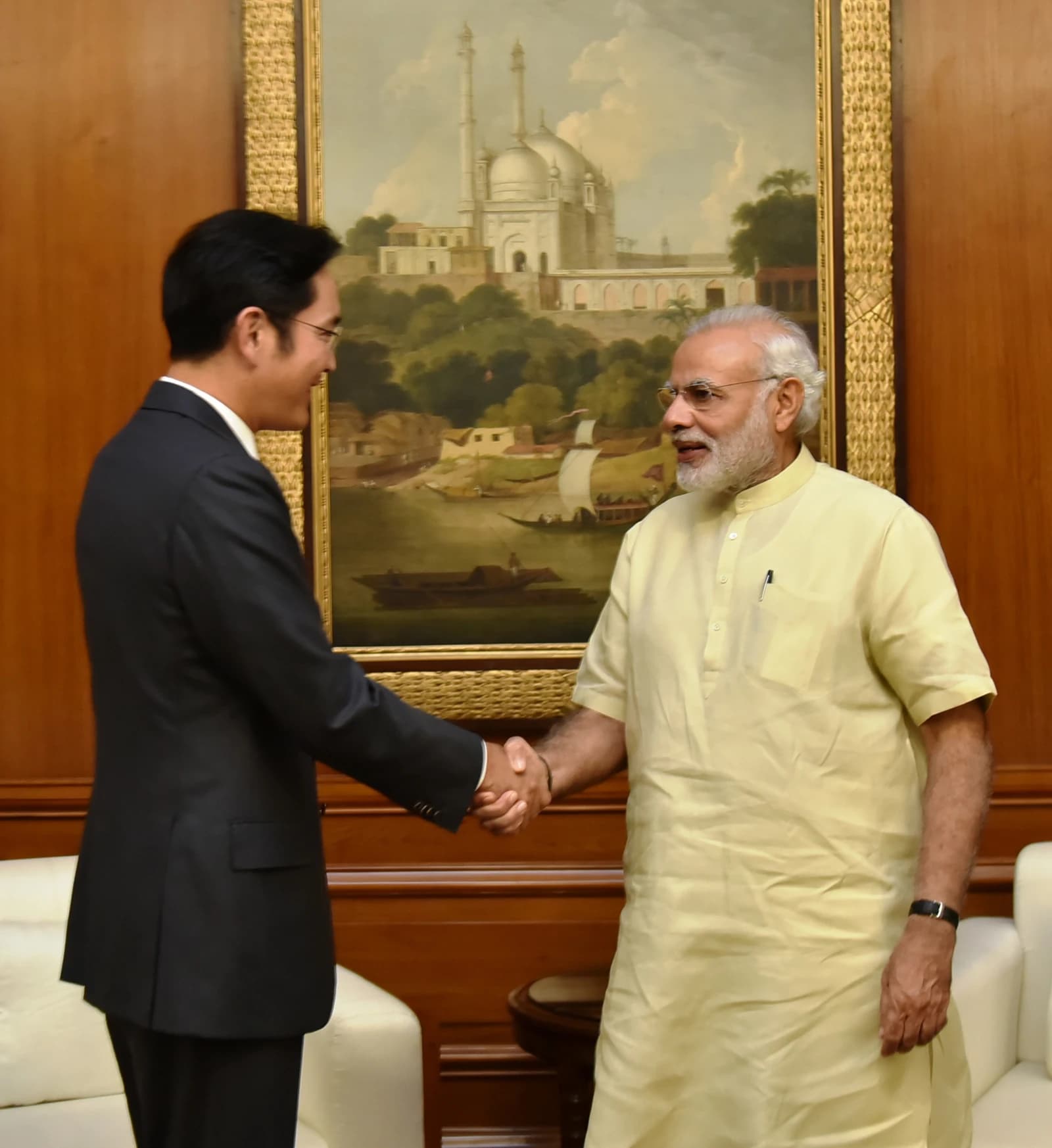 Jay Y. Lee, Vice Chairman of Samsung Electronics, shaking hands with Prime Minister Narendra Modi.