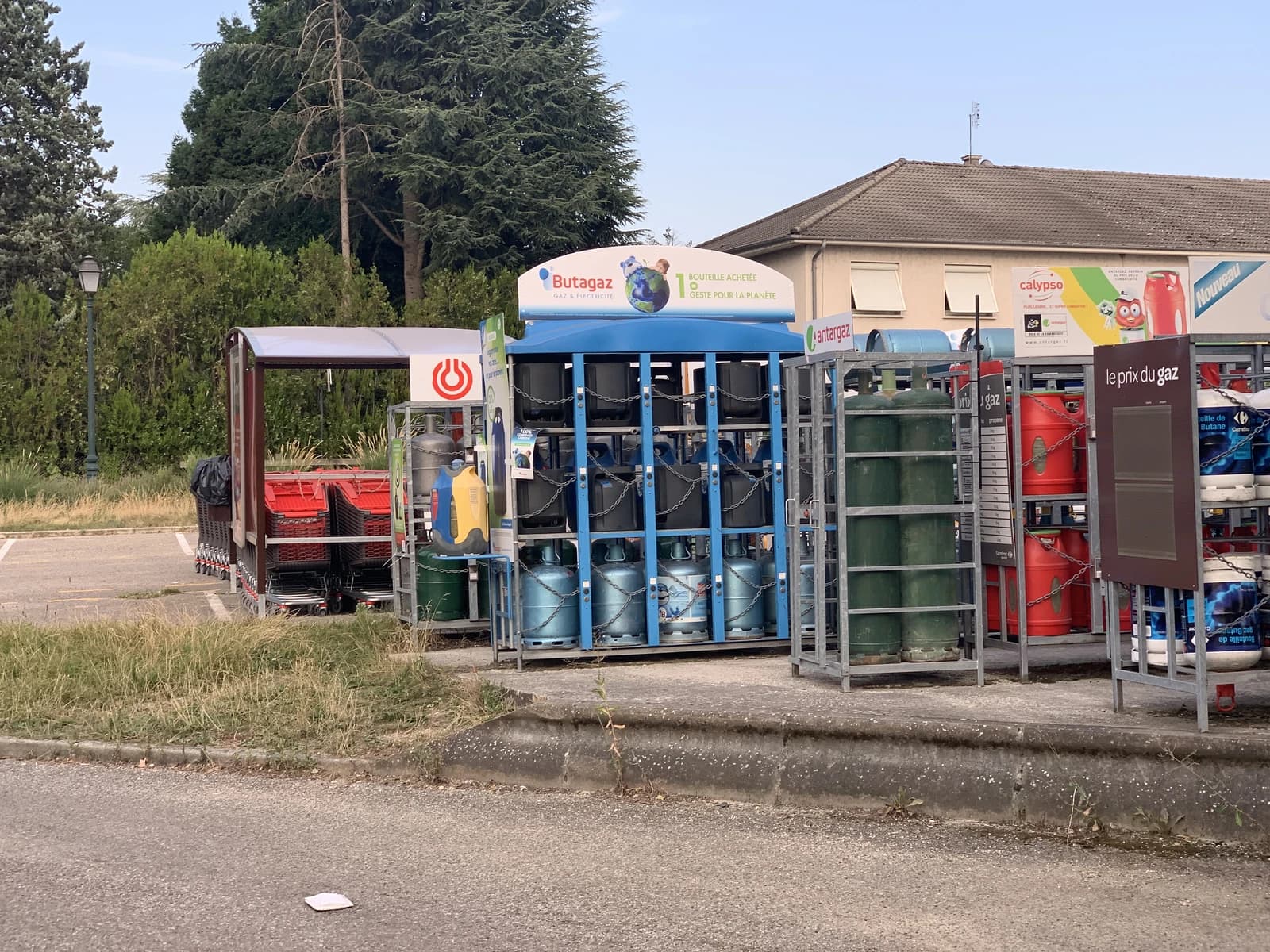 Gas bottles for sale outside a Carrefour Market supermarket in Vonnas, France.
