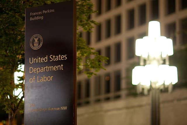 Sign for the United States Department of Labor in front of its building.