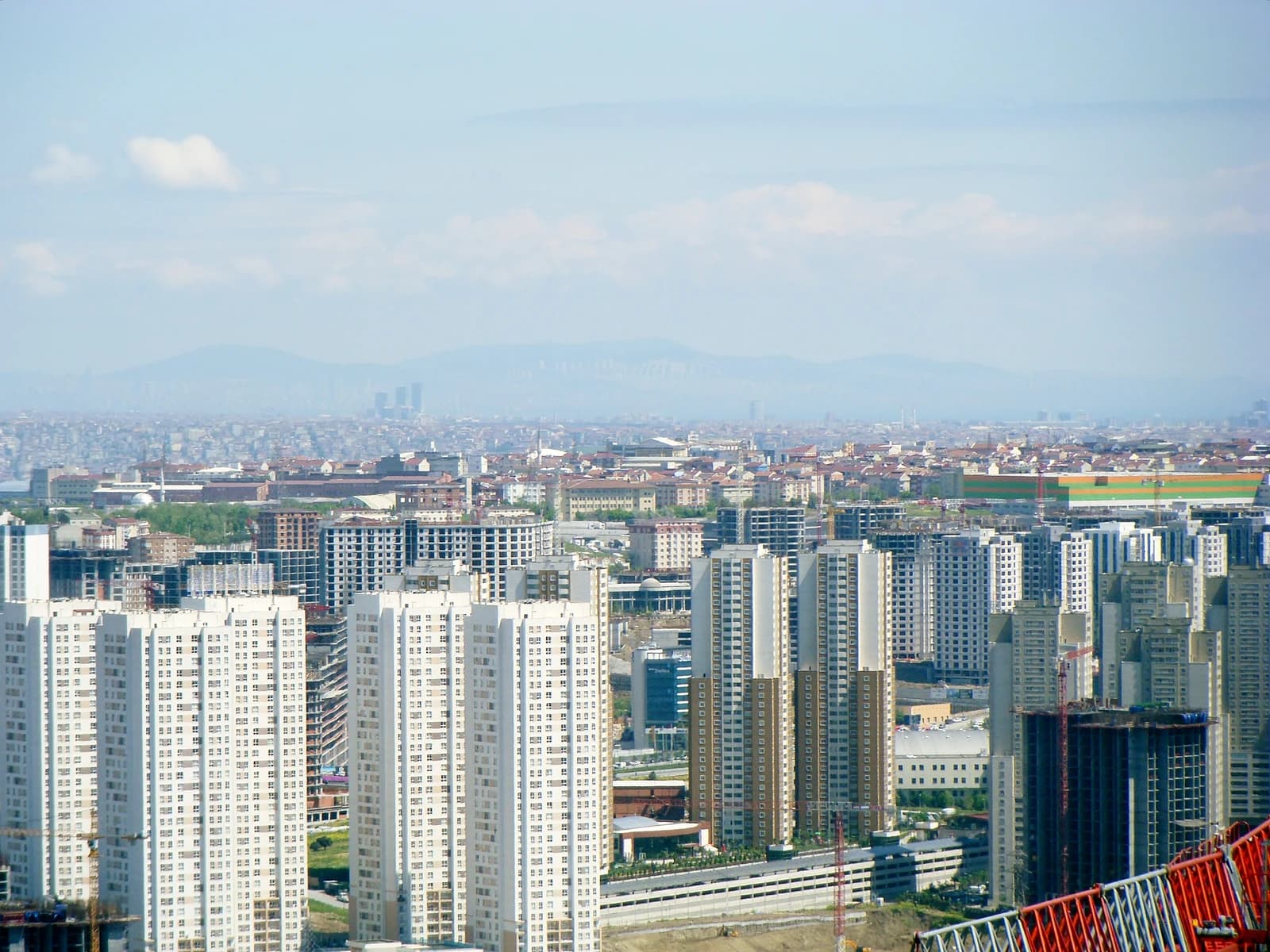 An expansive view of modern residential high-rise buildings and construction in Istanbul.