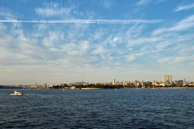 Cityscape of Istanbul's Kadıköy district, showing buildings along the waterfront and open water.