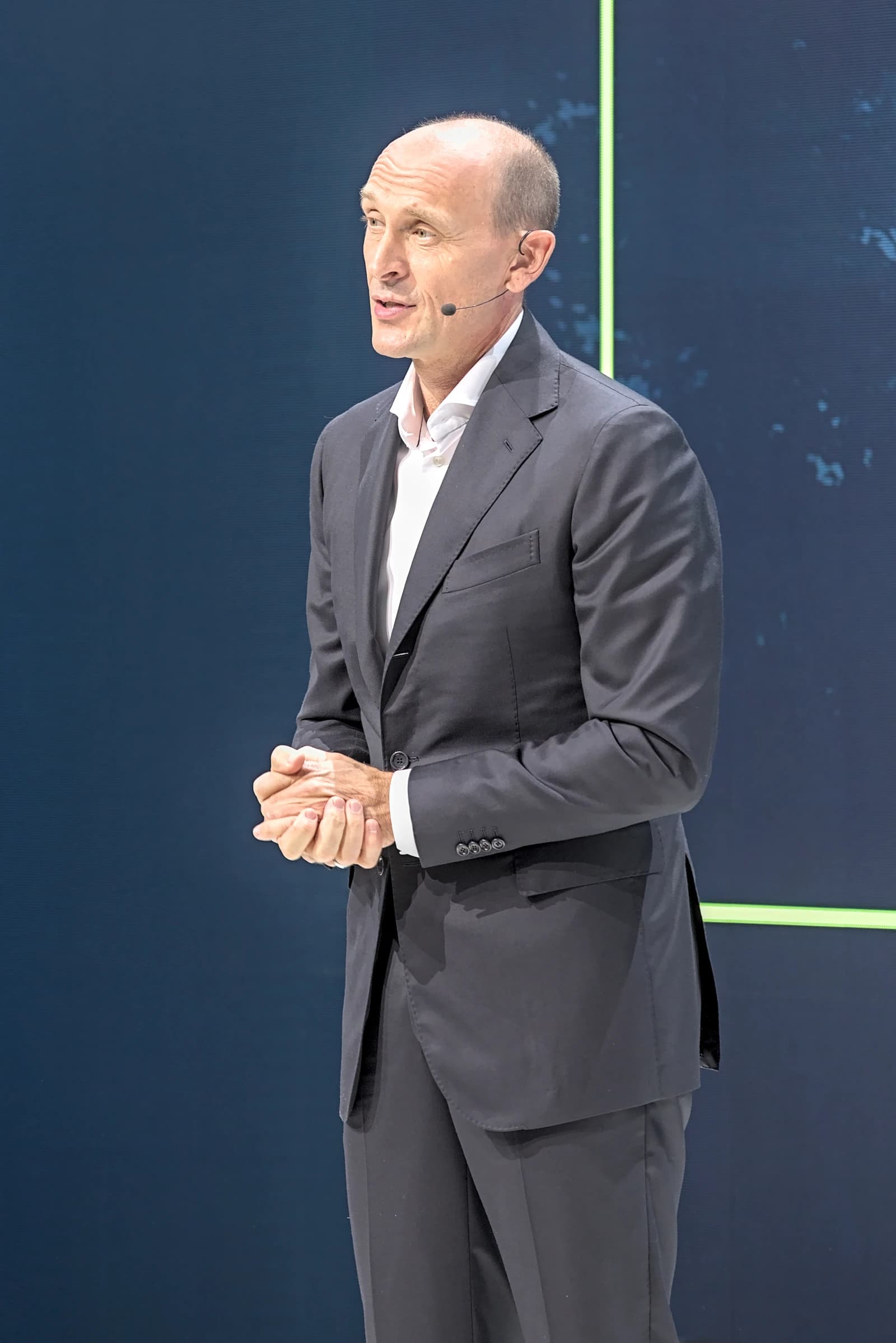 Ralf Brandstätter, CEO of Volkswagen Passenger Cars, speaking at a conference.