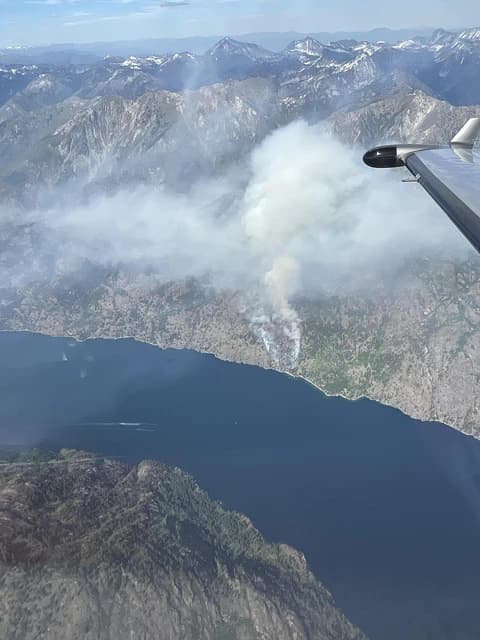 Pioneer Fire plume of smoke from wildfire over mountainous terrain, Okanagan-Wenatchee National Forest.