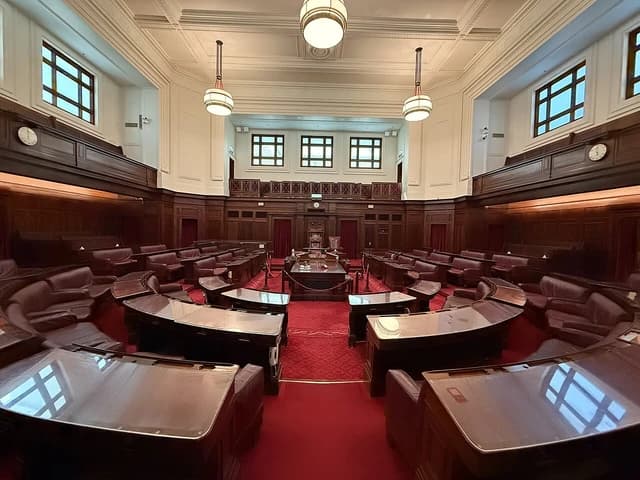 Australian Senate chamber, Old Parliament House, featuring seating, desks, and raised galleries.