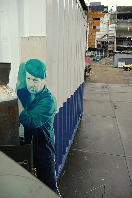 Construction container with a large picture on a demolition site in Amsterdam.