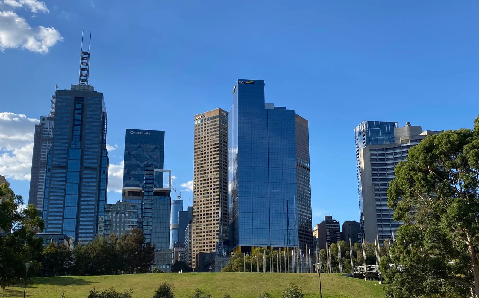 Melbourne's Birrarung Marr park with modern office buildings in the background.