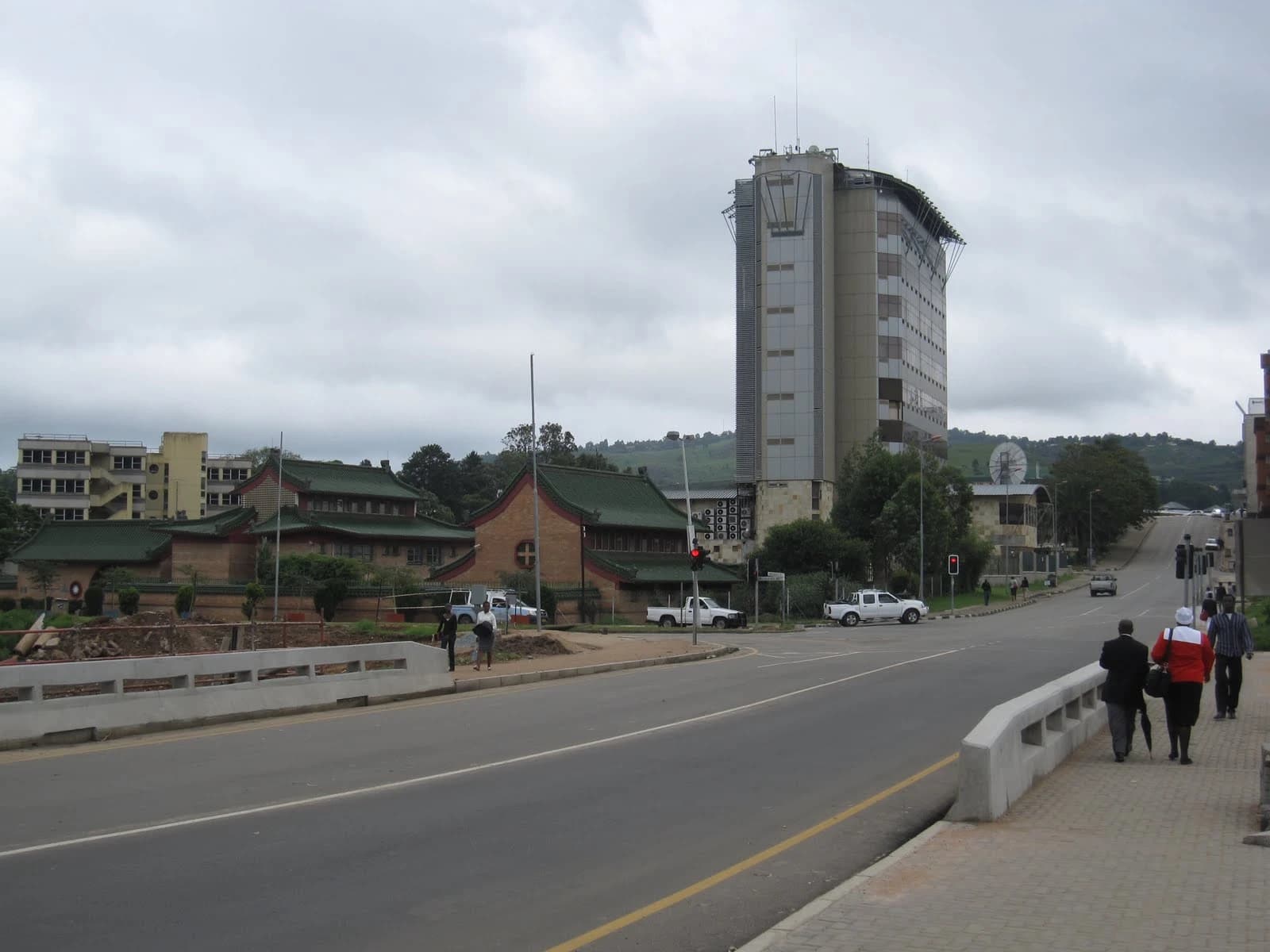 Central Bank of Eswatini building and surrounding street scene on a cloudy day.