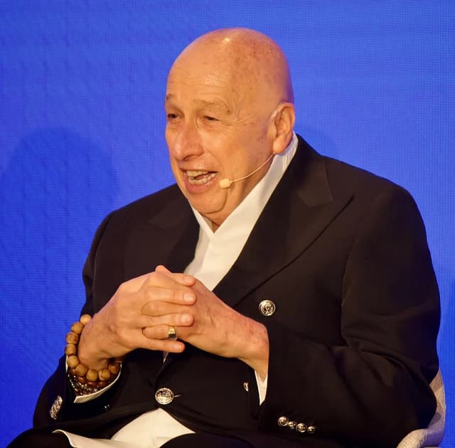 Allan Zeman, Hong Kong businessman and economist, speaking at an event.