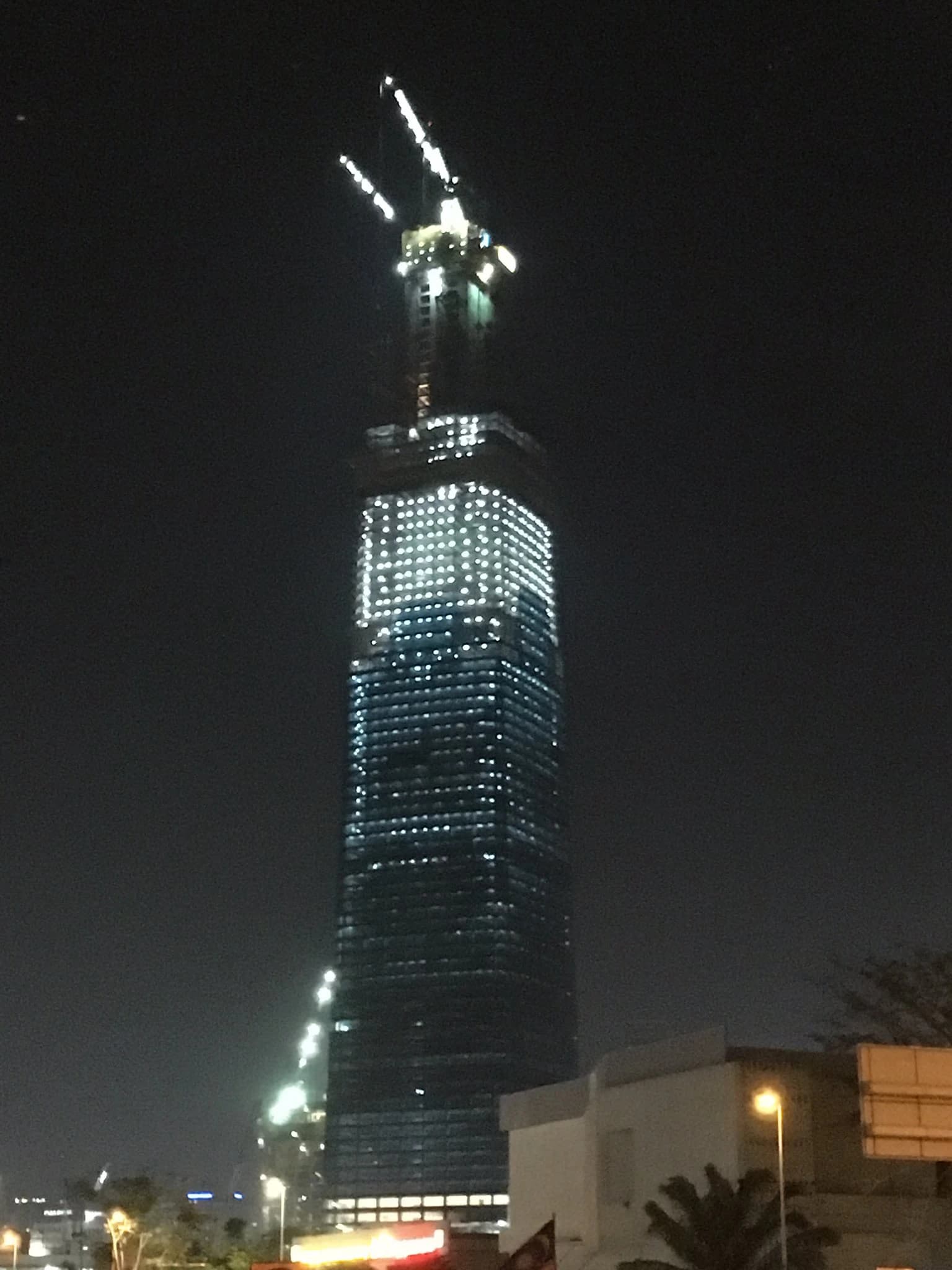 The Exchange 106 skyscraper illuminated at night in Kuala Lumpur, Malaysia.