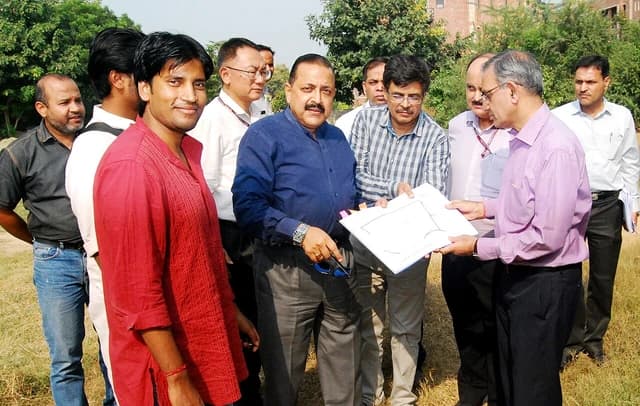 Jitendra Singh, Union Minister, visits JNU campus site with university officials and students.